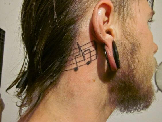 music note tattoo behind ear