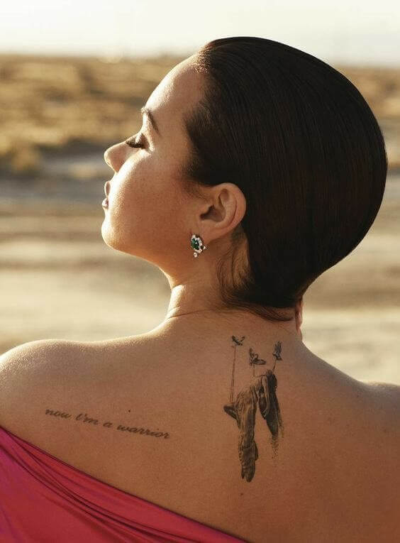 Demi Lovato Back Tattoo 1 Demi Lovato's Tattoos: The Teenage Idol Has More Than 30+ Designs On Her Body