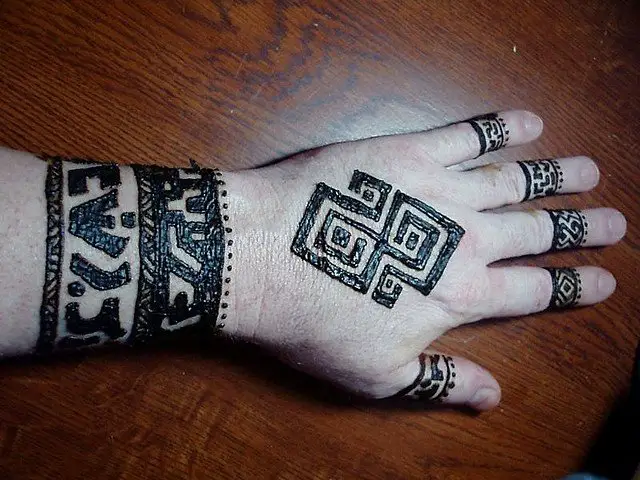 Bold Tribal Hand Tattoo Designs for Men